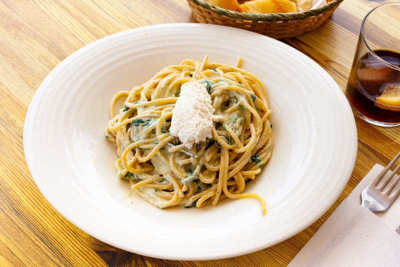 Appetizing pasta with ricotta and spinach stock photo