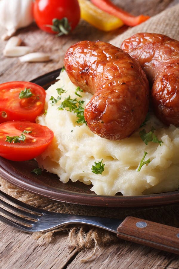 Sausages with Mashed Potatoes and Vegetables Closeup. Top View Stock