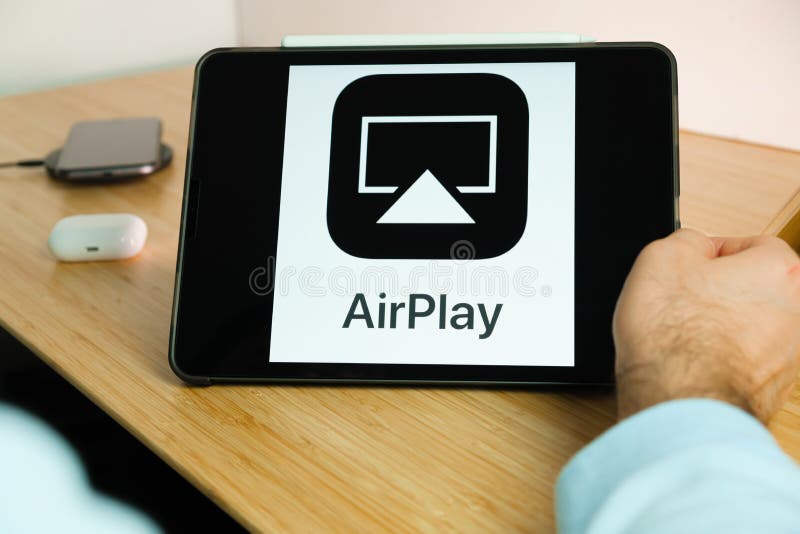 Apple AirPlay logo on the screen of iPad tablet. March 2021, San Francisco, USA