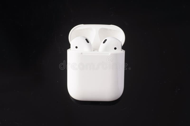 Apple Airpods on black background