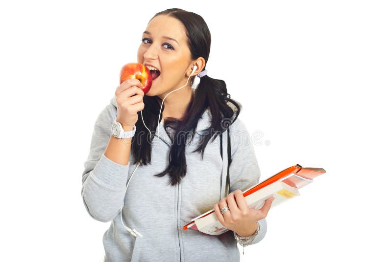 apple biting girl student fotografering för bildbyråer apple biting girl student fotografering för bildbyråer