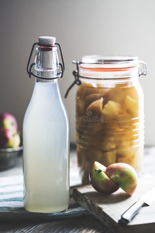 Apple Cider Vinegar in Hinged Lid Jar on Rustic Background Stock Image
