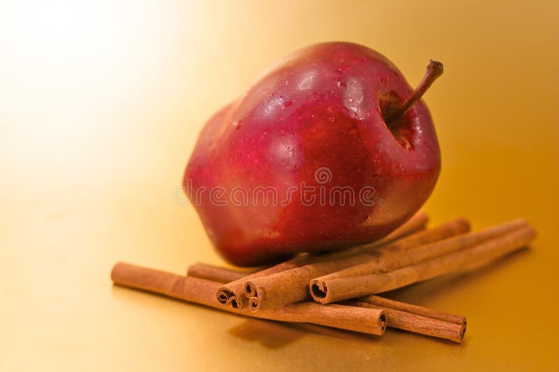 Apple with cinnamon sticks