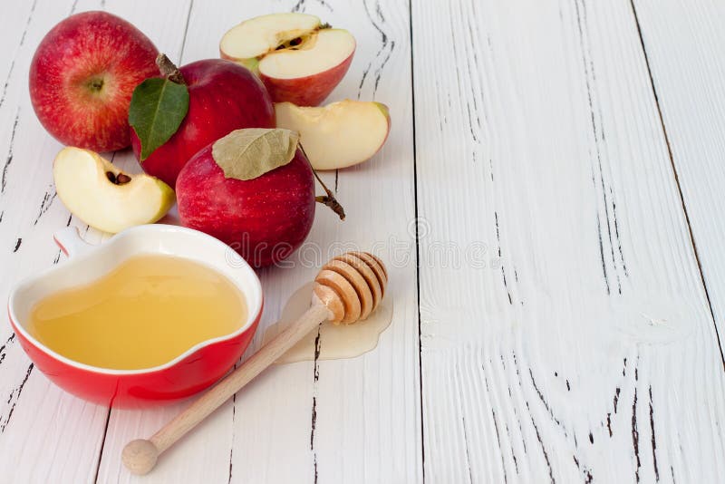 Apple e miele, alimento tradizionale del nuovo anno ebreo - Rosh Hashana Fondo di Copyspace fotografia stock libera da diritti Apple e miele, alimento tradizionale del nuovo anno ebreo - Rosh Hashana Fondo di Copyspace fotografia stock libera da diritti