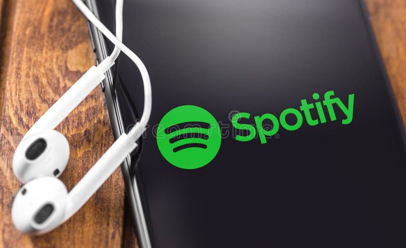 Apple Earpods and iPhone with Spotify logo
