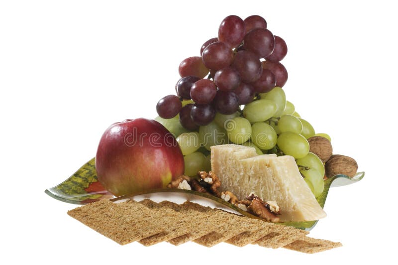 Apple, grape, nuts and cheese lying on a plate.