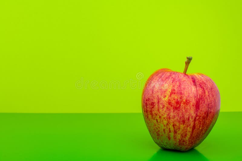 Apple on green background stock photo. Image of natural - 176084556