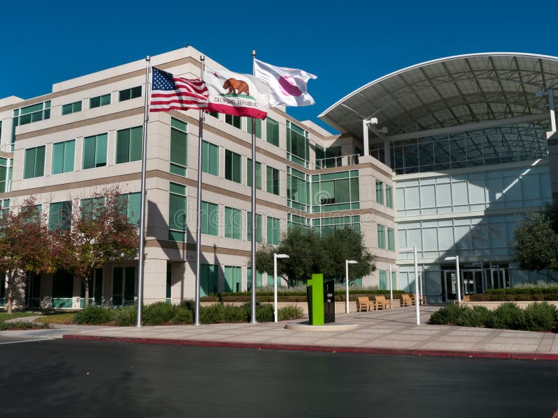 Apple headquarters in Cupertino California at Infinite Loop 1. US, California and Apple's flag blow in the wind. Apple headquarters in Cupertino California at Infinite Loop 1. US, California and Apple's flag blow in the wind.