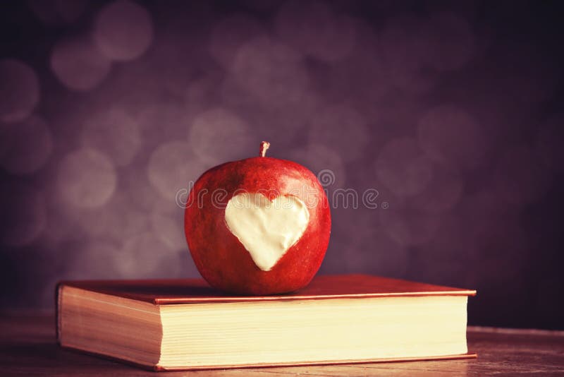 Apple with a heart cut into it