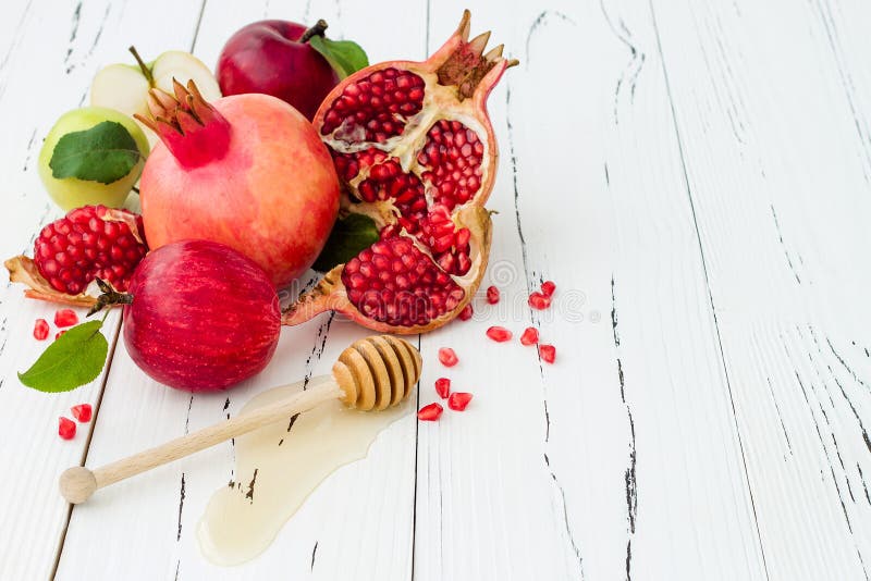 Apple and honey, traditional food of jewish New Year - Rosh Hashana. Copy space background.