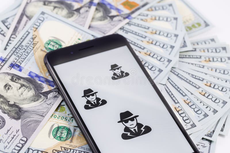 Apple iPhone 8+ with anonymous and hackers and money. Ekaterinburg, Russia - January 1, 2018. Apple iPhone 8+ with anonymous and hackers and money. Ekaterinburg, Russia - January 1, 2018