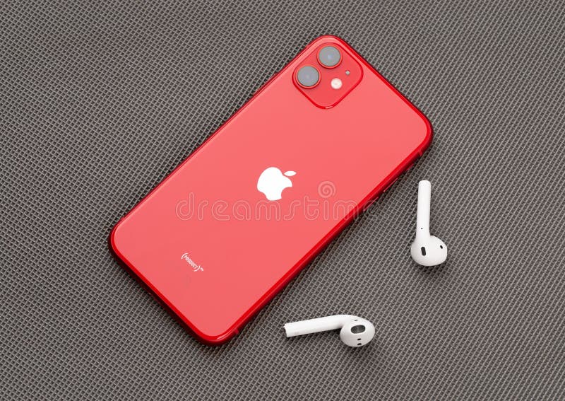 Apple IPhone 11 PRODUCT RED and Airpods on a Gray Surface. Editorial Image  - Image of equipment, luxury: 170016100
