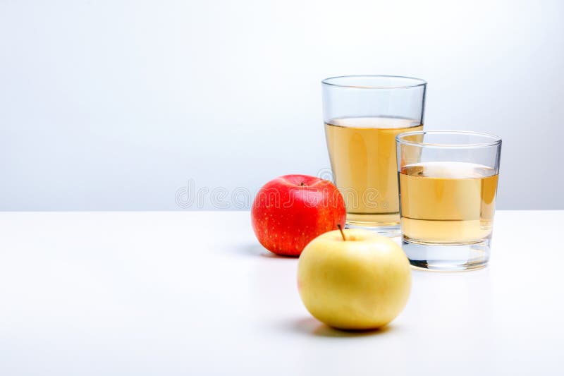 Apple juice in glass and apples. copy space stock images Apple juice in glass and apples. copy space stock images