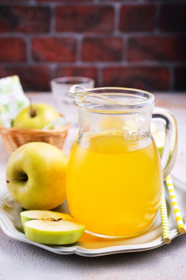 Apple juice in jug stock image. Image of juicy, delicious 129444621