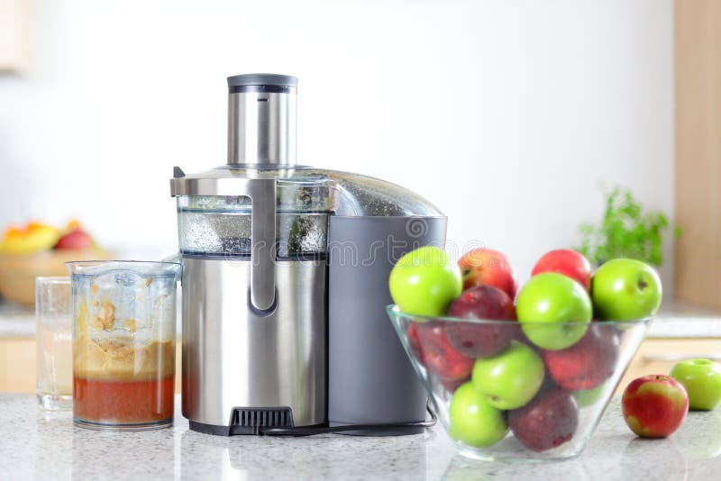 Apple juice on juicer machine - juicing