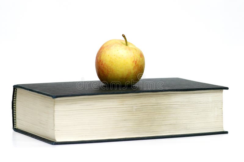 Apple no livro foto de stock royalty free Apple no livro foto de stock royalty free