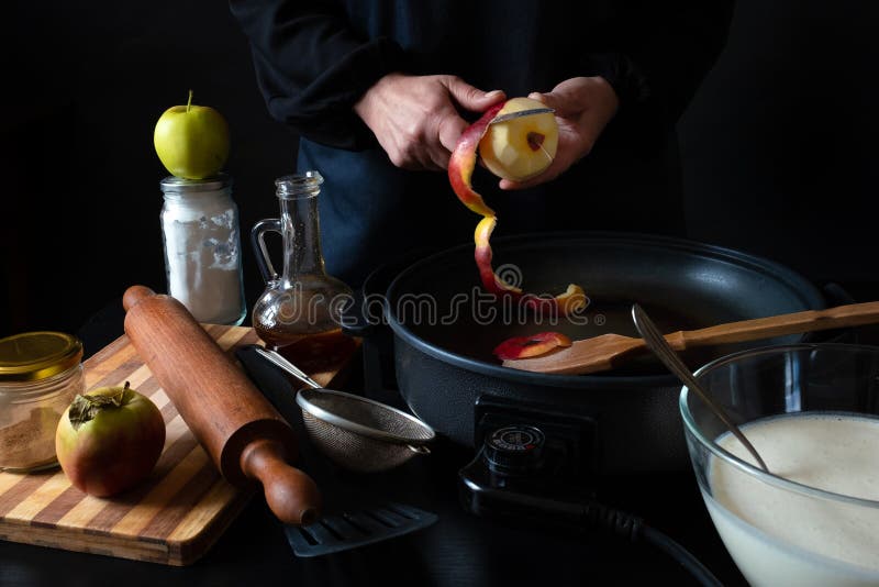https://thumbs.dreamstime.com/b/apple-pan-hands-knife-peel-cut-electric-black-background-chef-s-ripe-cooking-dessert-iron-183778989.jpg