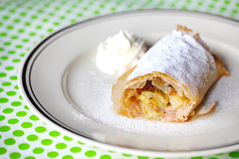 Apple and rhubarb strudel pastry with whipped crea