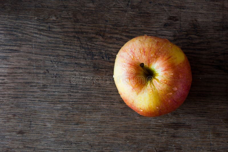 Apple on rustic wooden tabletop