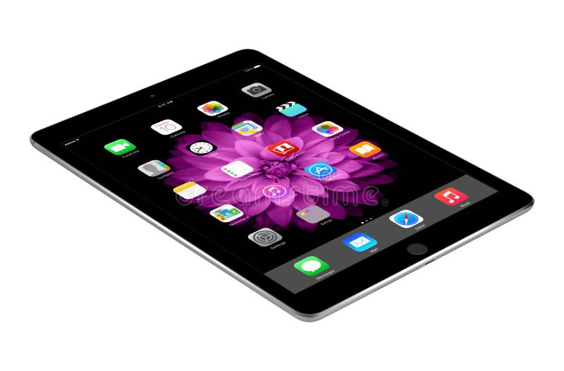 Apple Space Gray iPad Air 2 with iOS 8 lies on the surface, designed by Apple Inc.