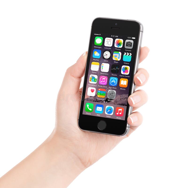 Apple Space Gray iPhone 5S displaying iOS 8 in female hand, designed by Apple Inc