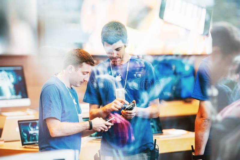 A Customer at an Apple Store Looking at His IPhone while Waiting at an Apple  Store Editorial Photo - Image of imac, computer: 237668441