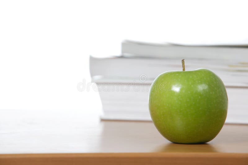An apple on the teachers desk