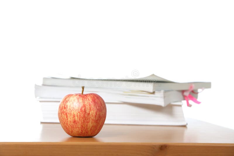 An apple on a teachers desk