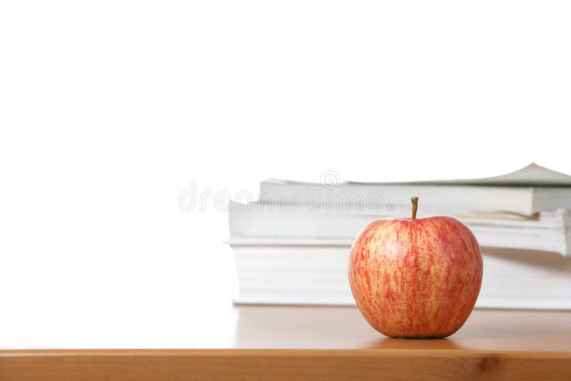 An apple on a teachers desk