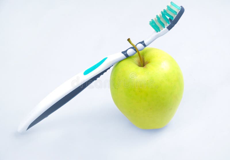 Apple with tooth brush stock photo. Image of nutrition 55912280