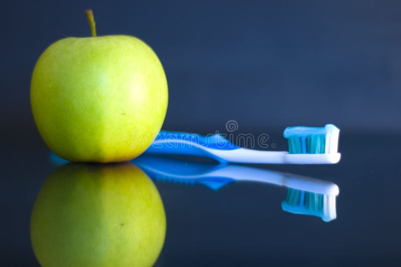 Apple and toothbrush royalty free stock photos Apple and toothbrush royalty free stock photos