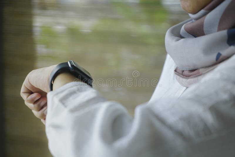 Apple Watch Series 5 on woman`s hand. Woman using smart watch. look at the screen