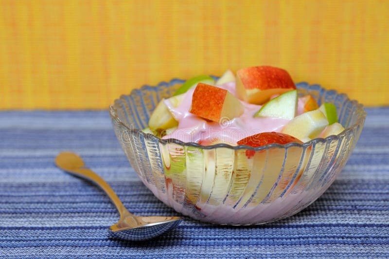 Apple and yogurt in bowl stock image. Image of cream 28325257
