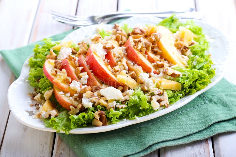 Apple and nut salad on plate. Apple and nut salad on plate