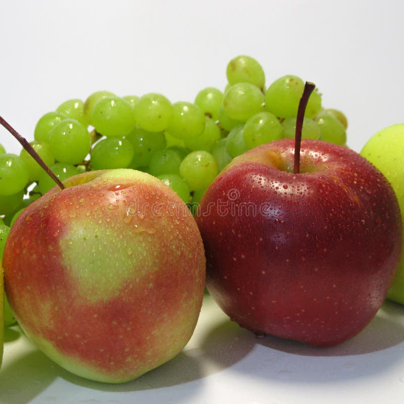 Apples and grapes - beauty and benefit, taste and health, an inexhaustible source of vitamins. stock photography Apples and grapes - beauty and benefit, taste and health, an inexhaustible source of vitamins. stock photography