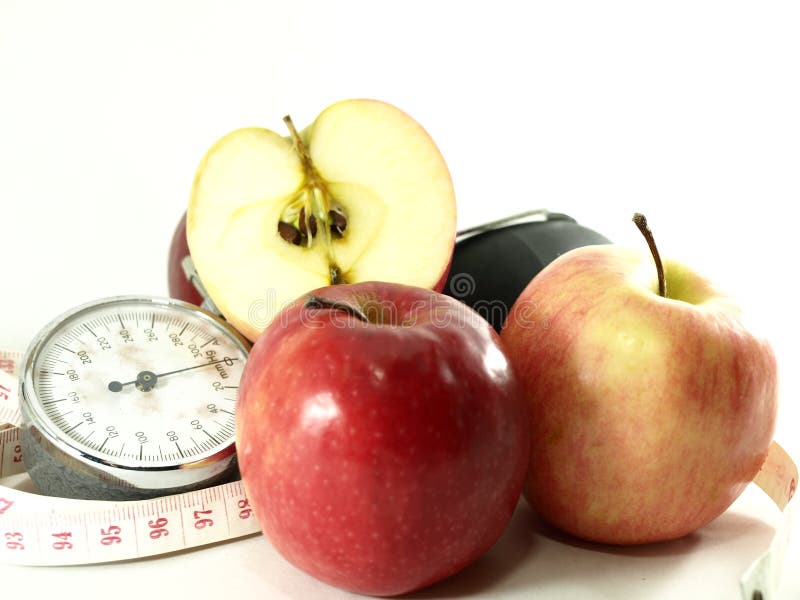 Apples, Measuring tape, Blood Pressure Pump royalty free stock photography
