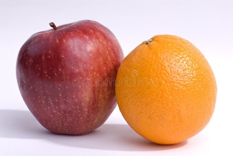 Apples and oranges isolated on a white background