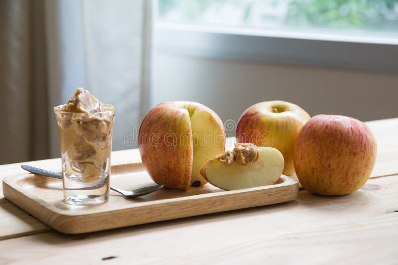 Apples with peanut butter stock image. Image of crispy 124526839