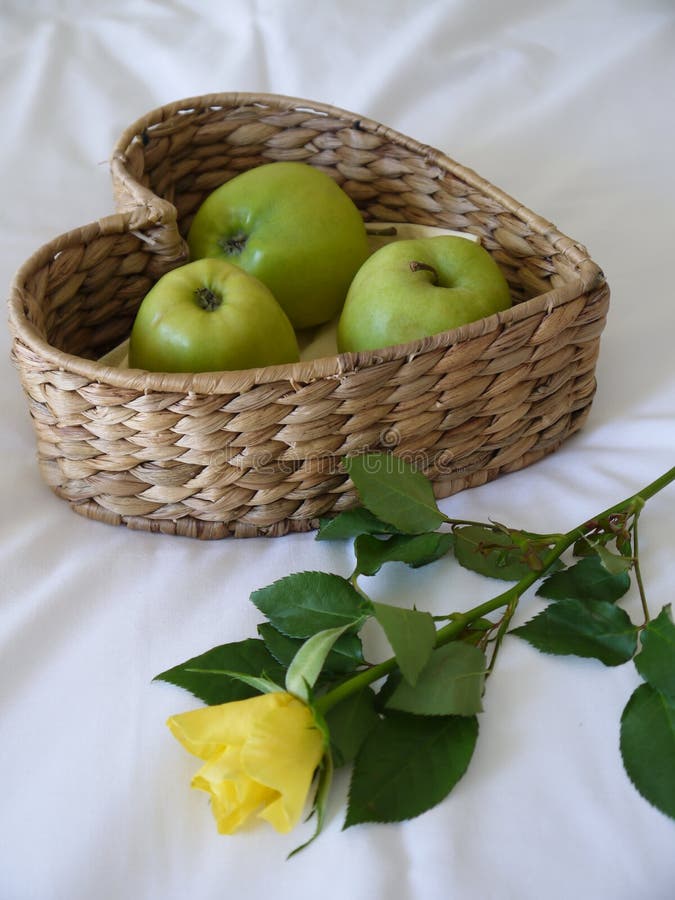 Apples & a yellow rose stock image. Image of fruit, brown 26005397