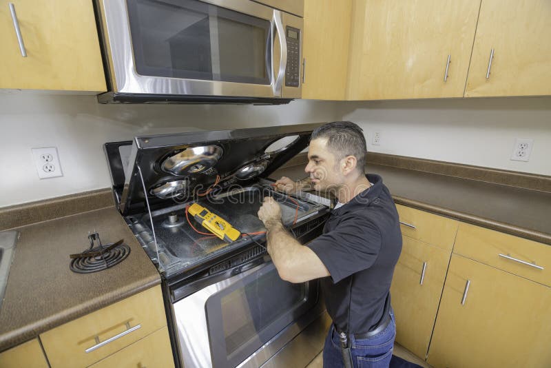 Appliance Technician Checking His Meter