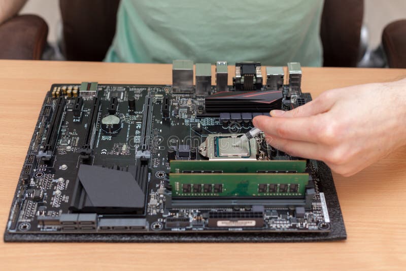 Application of thermal paste to the central processor of a computer. royalty free stock photos