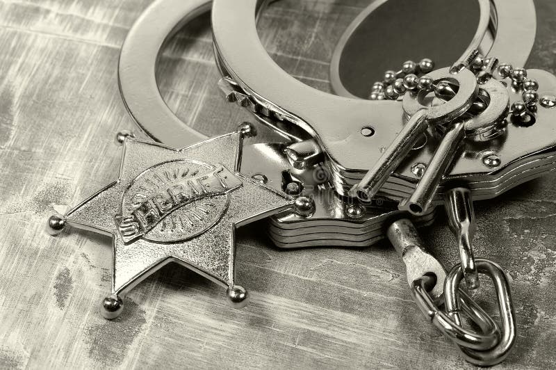 Badge and Handcuffs. Badge and Handcuffs