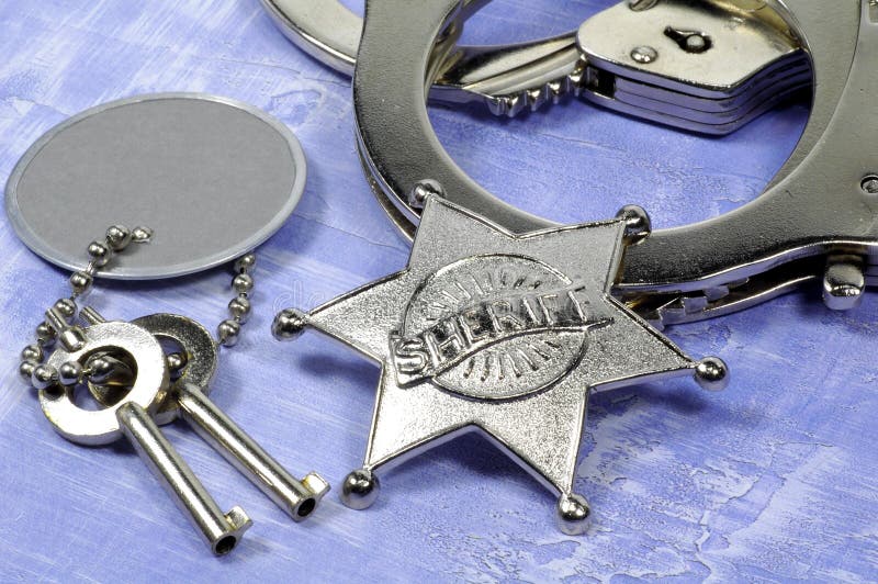 SHeriffs Badge and Handcuffs. SHeriffs Badge and Handcuffs