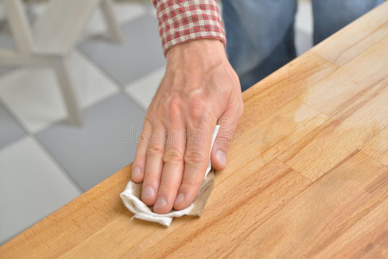 Applying the Danish oil stock photo. Image of wooden 42152130
