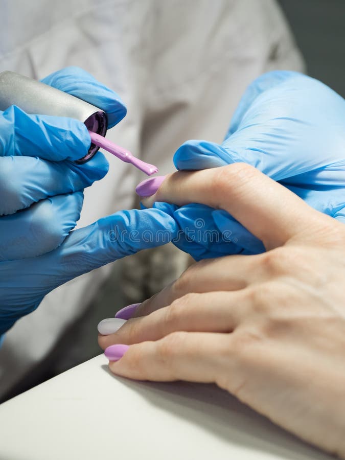 Applying Nail Polish in the Nail Salon. Close Up. Stock Image Image
