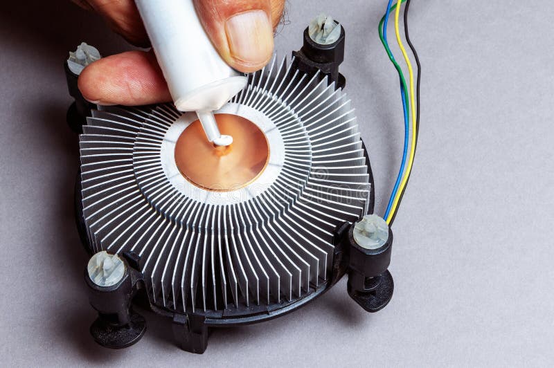 Applying Thermal Paste To the Surface Core of the Heat Sink Stock Photo
