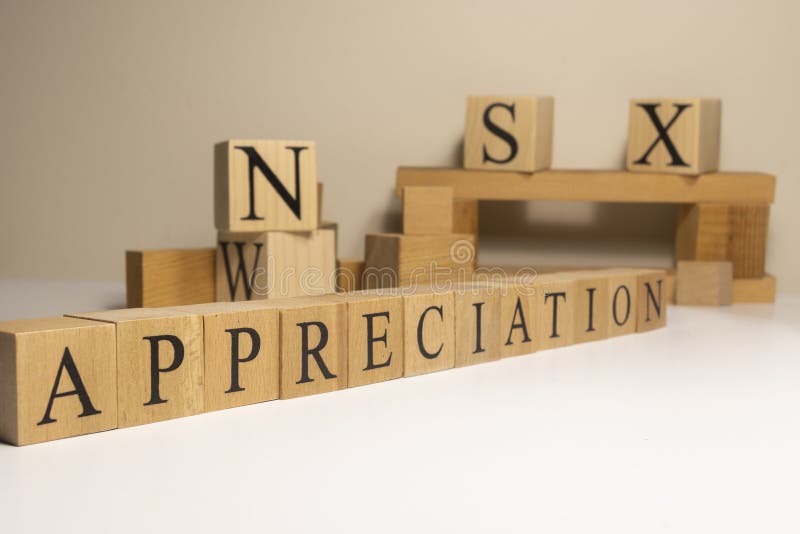 Appreciation. The term economy and trade. Written in wooden cubes. royalty free stock photography