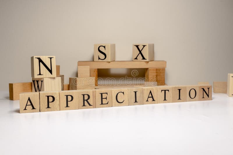 Appreciation. The term economy and trade. Written in wooden cubes. stock photos