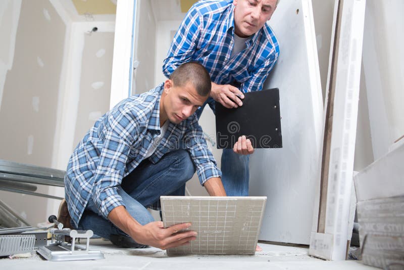 Apprentice Tile Setter Cutting Tile Stock Image Image of duty