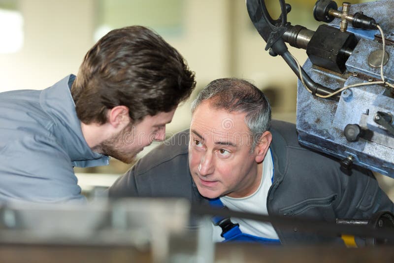 Apprentice Mechanic Working in Auto Repair Shop Stock Image Image of